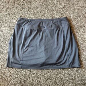 Tangerine sport skirt with built in shorts. Ruffle on back. Pocket. Golf. Tennis
